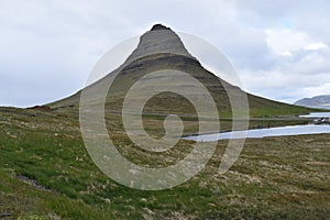 Famous kirkjufell mountain in GrundarfjÃÆÃâÃâÃÂ¶dur in Iceland photo